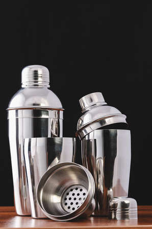 Three cocktail shakers for making summer cocktails at the bar. European shaker in disassembled form: glass, sieve, lidの写真素材
