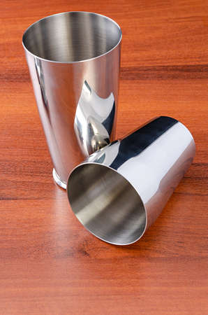Three cocktail shakers for making summer cocktails at the bar. European shaker in disassembled form: glass, sieve, lidの写真素材