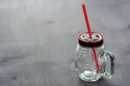Mug with the image of a soccer ball on the lid. copy spaceの写真素材