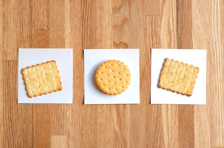 two crackers and cookies with filling, laid out on white stickersの写真素材