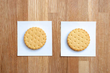 two cookies with filling, laid out on white stickersの写真素材