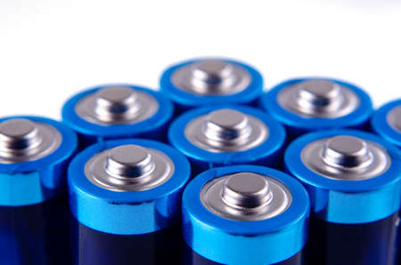 Blue-blue AA batteries close up on a white background. shallow depth of field, macroの写真素材