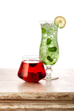 two cocktails on the wooden table isolated on white background, clipping pathの写真素材