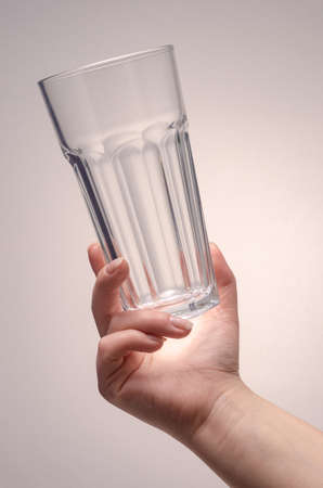 hand holding a glass on a white background. isolateの写真素材