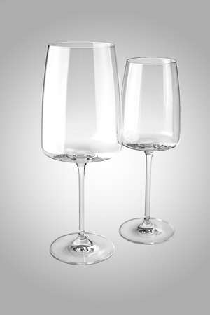 Two empty wine glasses isolated on whiteの写真素材