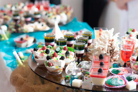 Luxurious desserts and drinks at the buffet table. Shallow depth of field.の写真素材