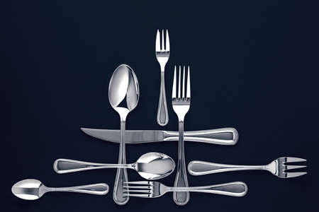 Stylish cutlery, on a dark blue background. View from above. Free space for textの写真素材
