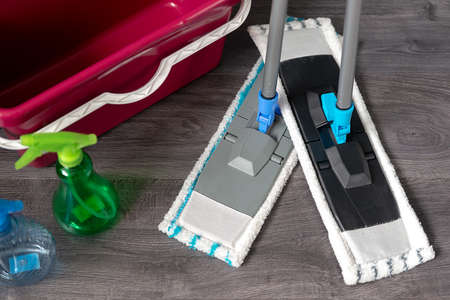 Top view of a modern sponge in the style of a mop used to clean a wooden floor with. Tools for...