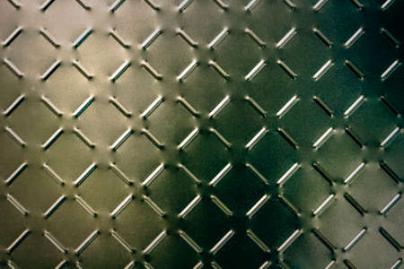 Seamless metal texture with repeating elements. vintage, grunge, backgrounds.の写真素材