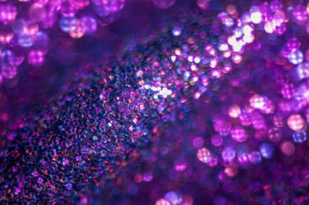 Background of abstract glittering lights. Blue and purple. Bokeh.の写真素材