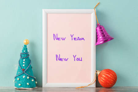 New year motivational quote in the frame new year new you. On both sides of the frame and on the...