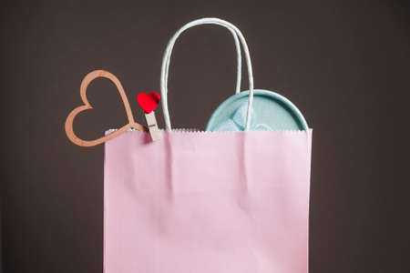 Gifts are visible from the pink gift bag. Blue round box and heart.の写真素材