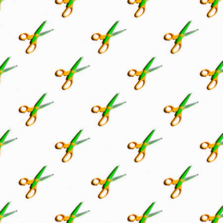 Patterns on a white background. Orange-green scissors ..の写真素材