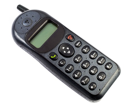 Vintage cellphone isolated on white backgroundの写真素材