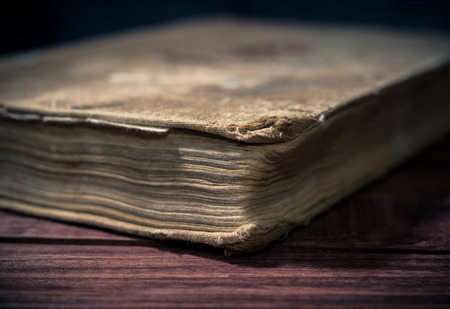 Ancient rare book on wooden backgroundの写真素材