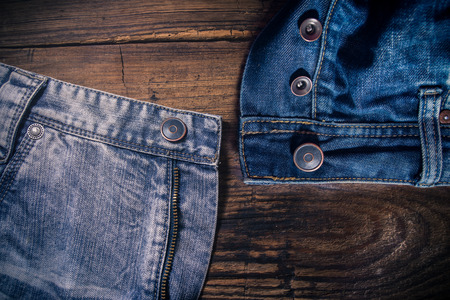 Denim jeans on the wooden tableの写真素材