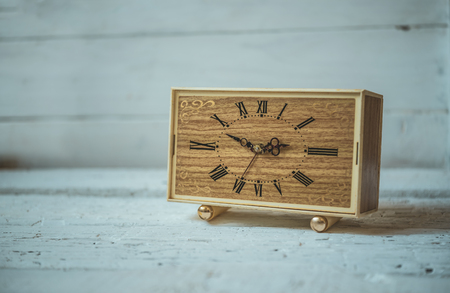 Old vintage clocks on wooden backgroundの写真素材