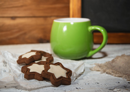Morning coffee with some start-shaped chocolate cookiesの写真素材