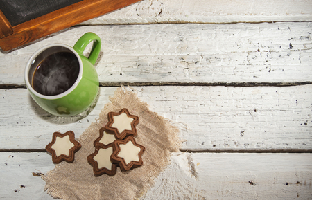 Morning coffee with some star-shaped chocolate cookiesの写真素材