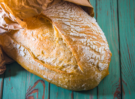Freshly baked french bread on rustic backgroundの写真素材