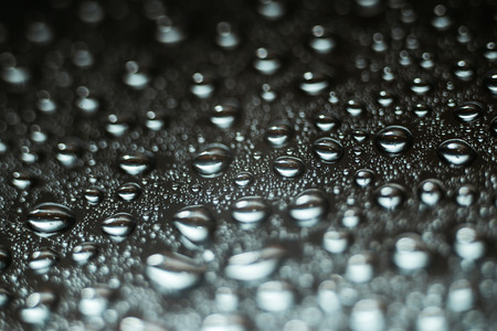 Water droplets on chrome metallic surface, abstract macro