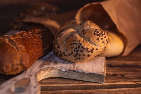 Various homemade bread on rural wooden backgroundの写真素材