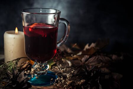Glass of glintwein close up, rustic style, dark photoの写真素材