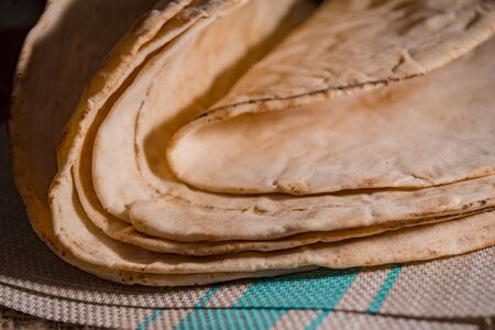 Pitta bread on rural wooden backgroundの写真素材