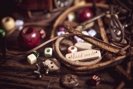 Materials for handmade decorations, leather, beads, ropes, buttonsの写真素材