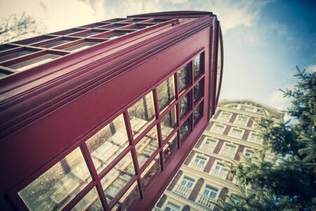 Towering british red phone booth, symbol of London