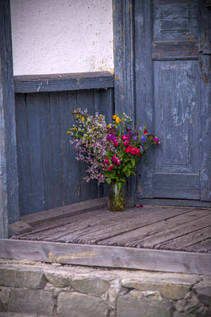 Wildflowers bouquet on the stairs, rural still lifeの写真素材