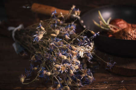A bouquet of dry flowers on wooden backgroundの写真素材