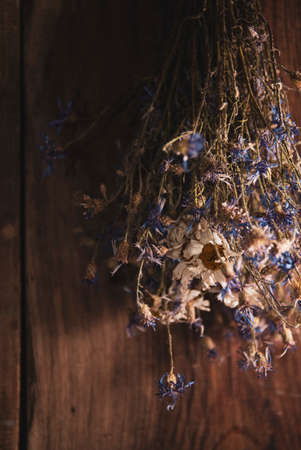 A bouqet of dry flowers on wooden backgroundの写真素材