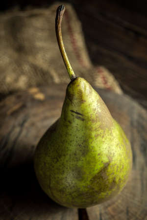 Green pears, fresh fruits on wooden backgroundの写真素材