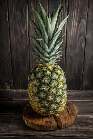 Rural still life with pineapple on wooden backgroundの写真素材