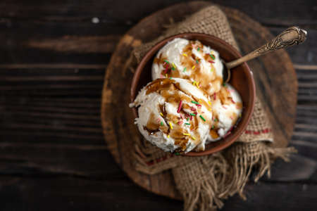Assorted ice cream on wooden background
