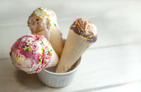 Assorted ice cream on wooden background