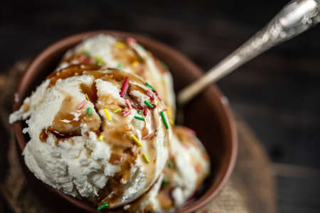 Assorted ice cream on wooden backgroundの写真素材
