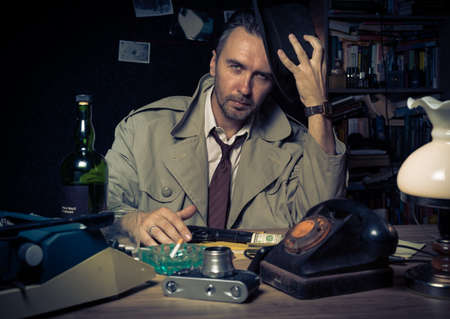 Retro private detective behind the desk, noir cinematic sceneの写真素材