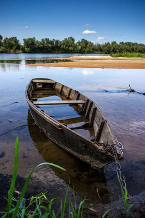 Old wooden boat near the Ukrainian Desna river, close up shotの写真素材
