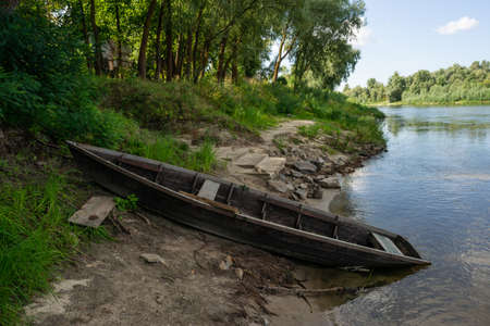 Old wooden boat near the Ukrainian Desna river, close up shotの写真素材