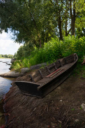 Old wooden boat near the Ukrainian Desna river, close up shotの写真素材