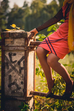 Lady in orange enjoying the parkの写真素材