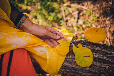Lady in orange enjoying the parkの写真素材