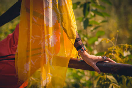 Lady in orange enjoying the parkの写真素材