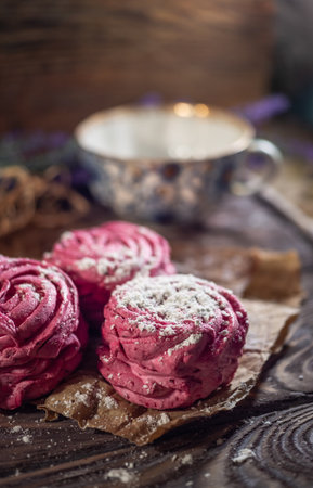 Fresh pink zephyr marshmallow on a wooden rustic backgroundの写真素材