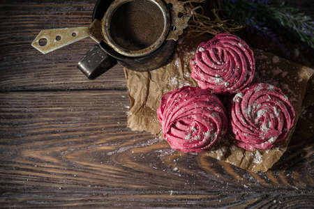 Fresh pink zephyr marshmallow on a wooden rustic backgroundの写真素材