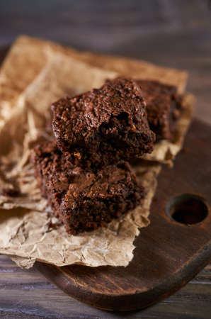 Freshly baked tasty chocolate brownies on a wooden backgroundの写真素材