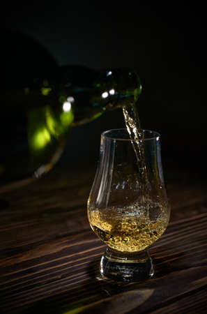 Filled whisky glass, sniffer, tasting crystal glassの写真素材