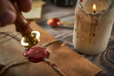 Sealing wax on ancient papers, antique stamp, and old documents, brass spoonの写真素材